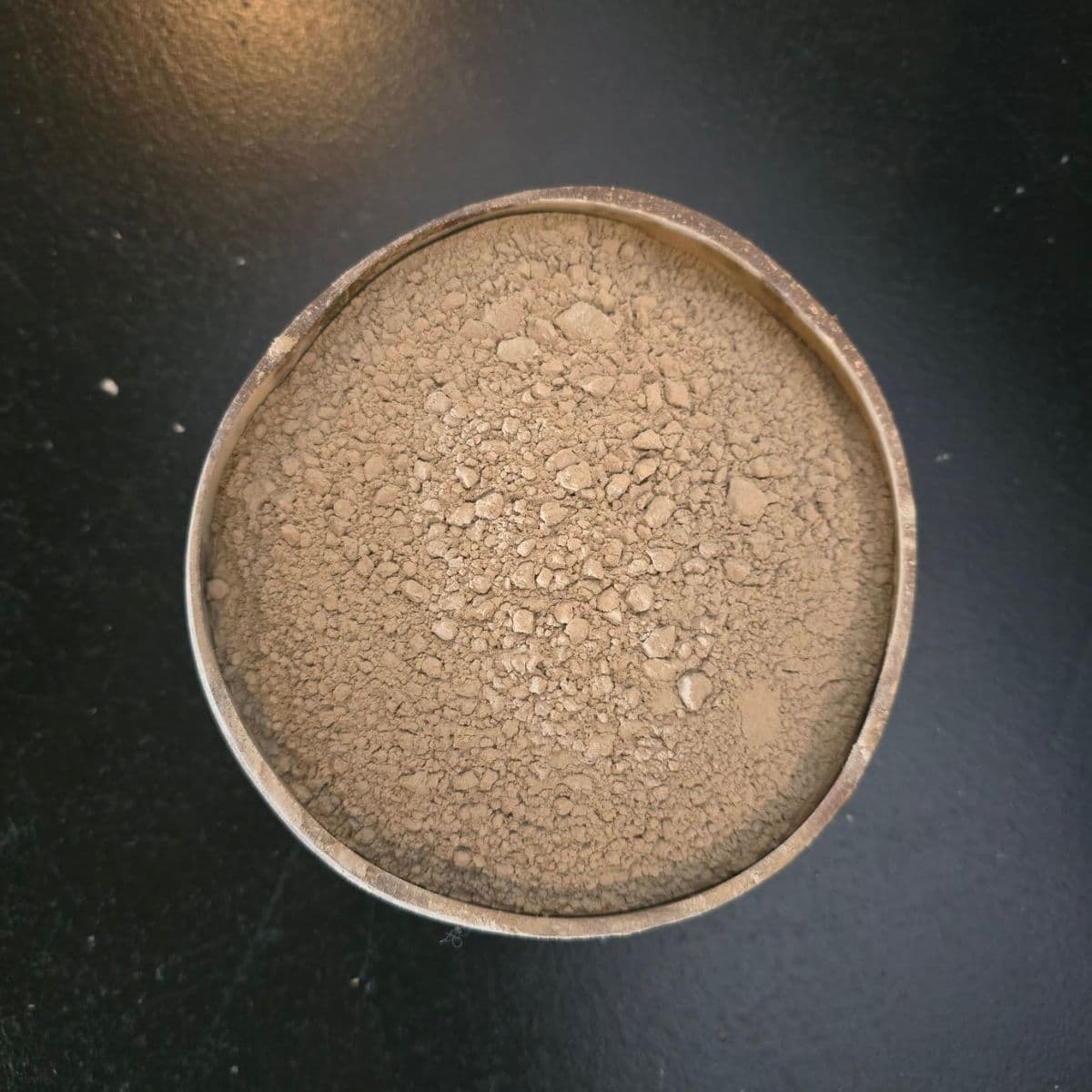 instant green kava powder inside of a coconut shell